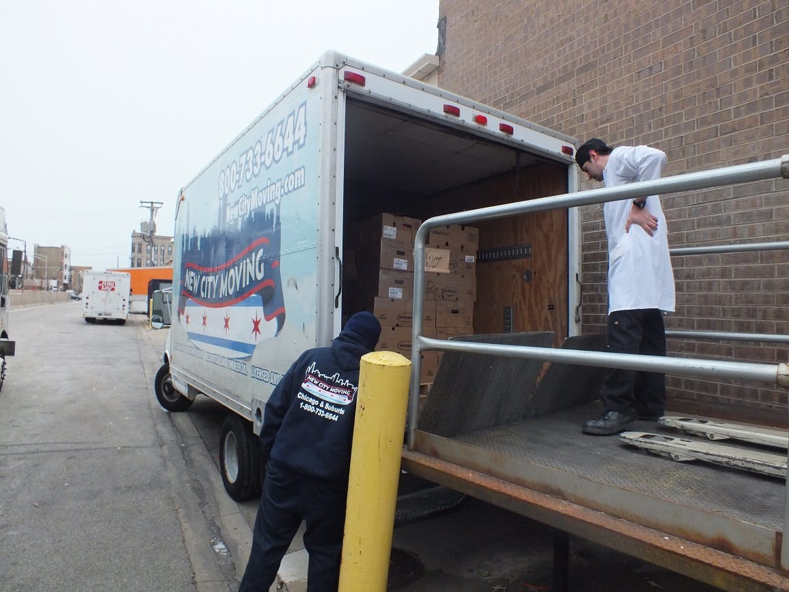 New City Moving employees donate some turkeys.