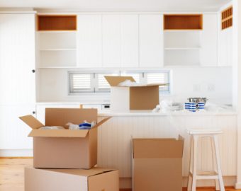 unpacking cardboard boxes in the kitchen