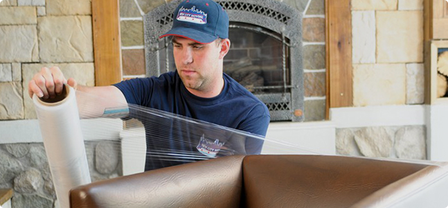 New City Mover wrapping up furniture for moving in Chicago