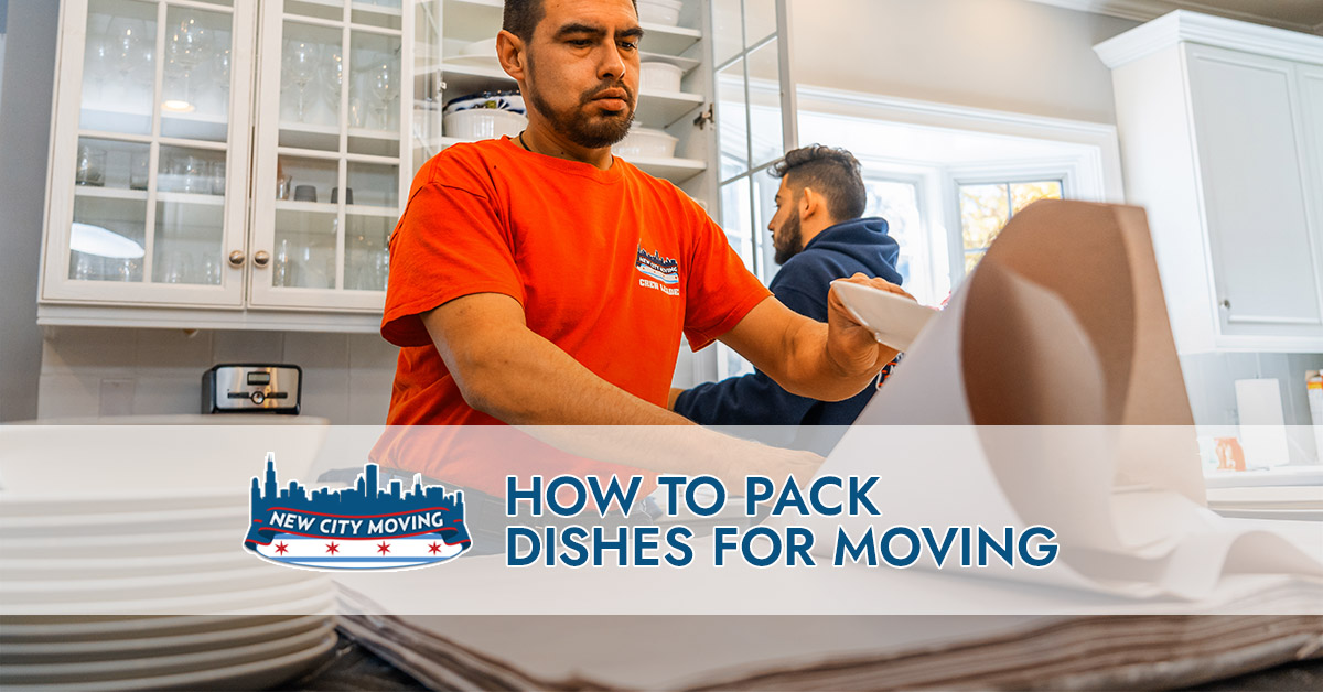New city movers packing away dishes.