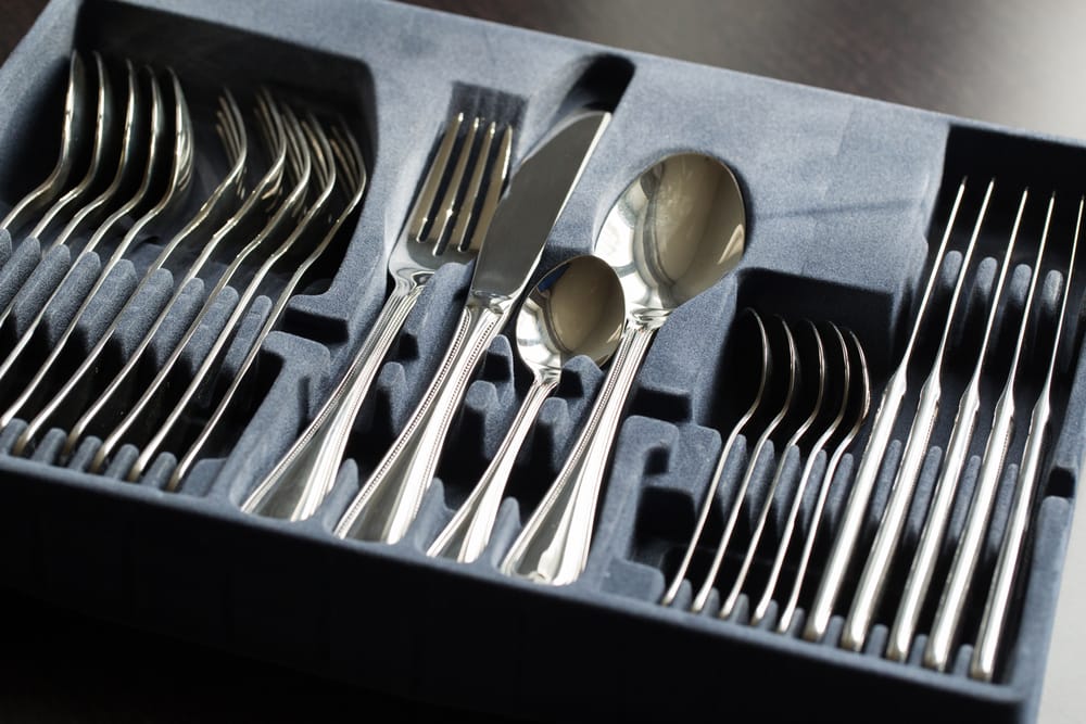 Packing silverware for moving.
